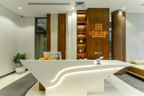 a bathroom with a white sink in a room at Lé Blend Residence in Krong Poi Pet