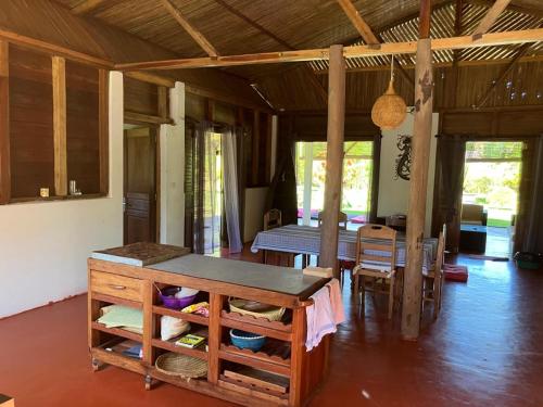 a kitchen and dining room with a table and chairs at Villa Masoandro in Sainte Marie