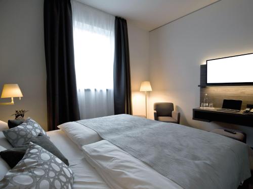 Hotel Eislinger Torにあるベッド