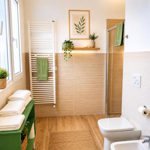 a bathroom with a shower and a toilet and a sink at TerrazzaPonente in Monte San Pietro