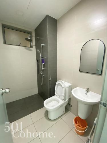a bathroom with a toilet and a sink at Cyberjaya - Netflix - Disney - Wifi in Cyberjaya