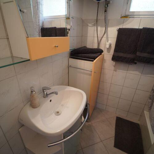 a bathroom with a sink and a mirror at Vár-Lak Nagymaros in Nagymaros