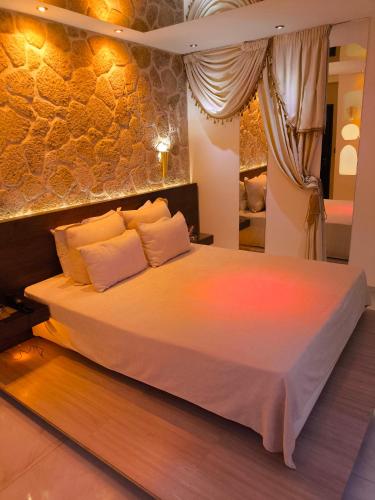 a bedroom with a large bed in a room at GLS Priamos in Piraeus
