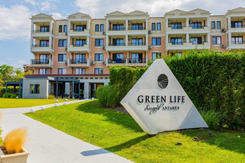 a sign in front of a large building at Green Life Sozopol Antares in Sozopol