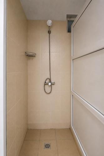 a shower with a glass door in a bathroom at Хостел Арабея in Vinnytsya