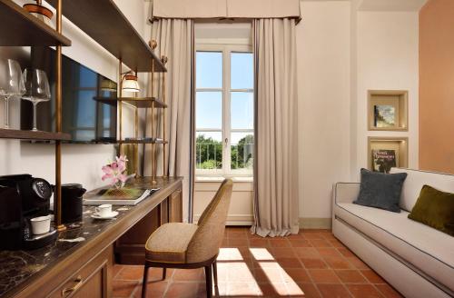 a living room with a couch and a table at Relais Sant'Uffizio in Cioccaro