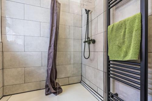 a shower with a glass door in a bathroom at Group-Friendly, Sheffield Flat, sleeps 6 in Walkly