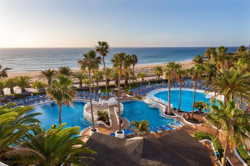 an aerial view of a resort with a pool and the beach at SOL by Meliá Lanzarote All Inclusive in Puerto del Carmen