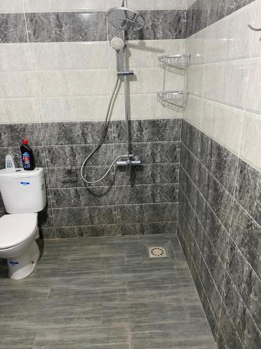 a bathroom with a shower and a toilet at Appartement 1 in Al Hoceïma