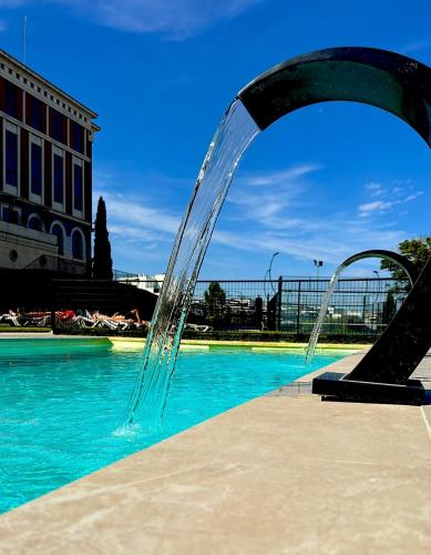 a water fountain in the middle of a pool at Villa Augusta Spa & Garden in Valladolid