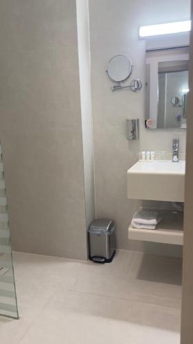 a bathroom with a sink and a mirror at Tim in Riyadh