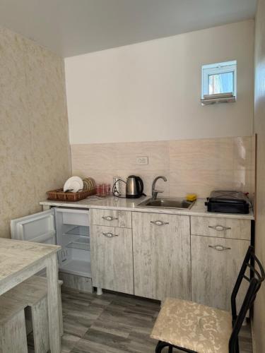 a small kitchen with a sink and a counter at Hotel barbie Cottage #1-2 in Ureki