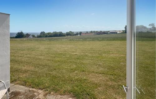 a view of a field from a window at Pet Friendly Apartment In Allinge in Allinge