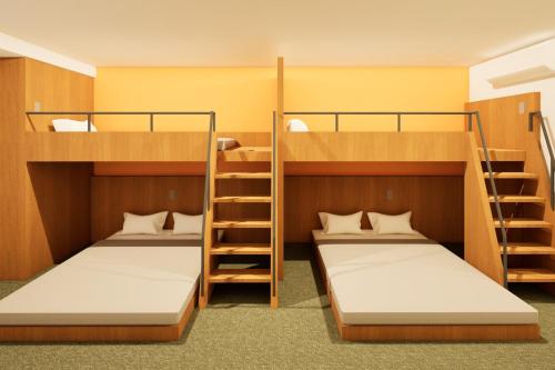 two bunk beds in a dorm room at HOTEL tuka miika in Ishigaki Island