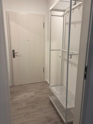 an empty closet with a glass door and a shelf at Edi`s Ferienwohnung in Eltmann