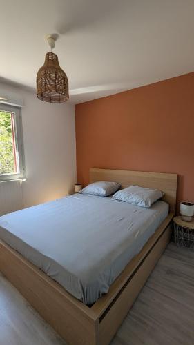 a bedroom with a large bed in a room at Cozy apartment with exceptional view in Gex