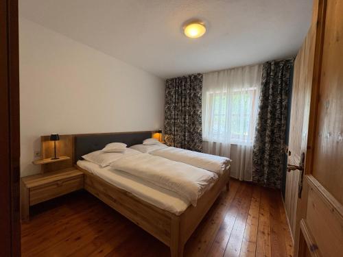 a bedroom with a large bed in a room at Ferienwohnung Stern, Natters in Innsbruck