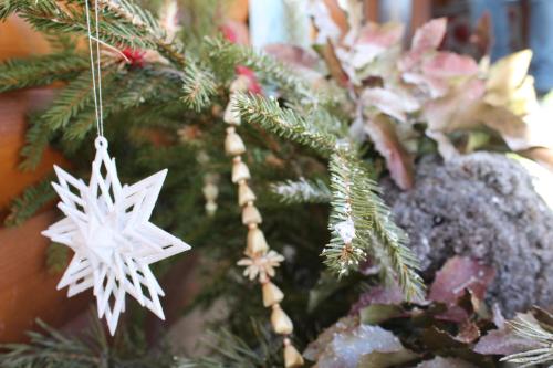 a christmas tree with snowflake ornaments on it at Chata Horec in Liptovské Revúce