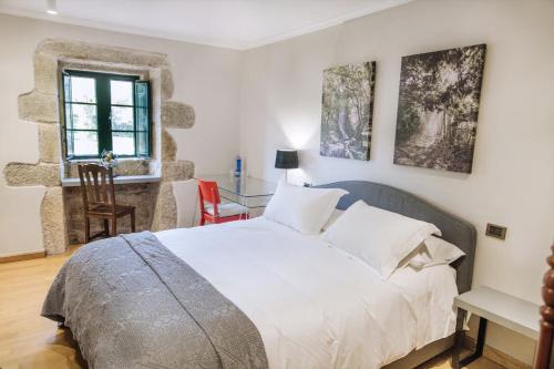 Tempat tidur dalam kamar di Casa Quinteliña