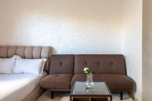 a living room with a couch and a table at TT holidays Prestigia Hay Riad-Pool in Rabat