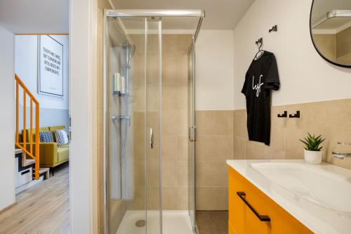 a bathroom with a shower and a sink at lyf Schönbrunn Vienna in Vienna
