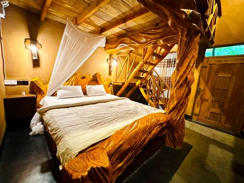 a bedroom with a bed with a wooden canopy at Ama Eco Lodge in Sigiriya
