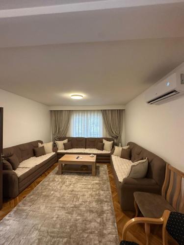 a living room with a couch and a table at Te Pishat in Brezovica