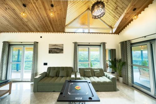 a living room with a couch and a table at Earth by The StayCationer in Dehradun