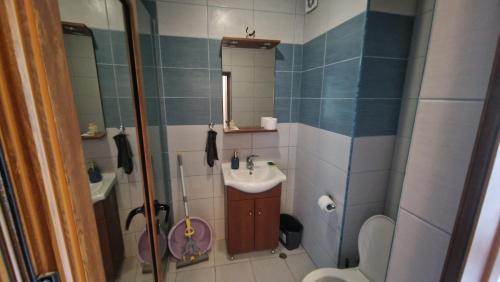 a small bathroom with a sink and a toilet at Apart Complex Pontica - Sea View 20 in Chernomorets