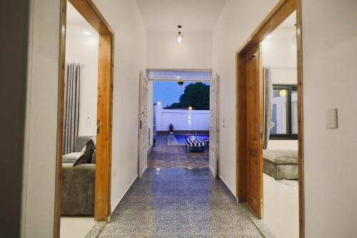 a hallway with two doors leading to a room at Nile Kingdom Guest house in Luxor