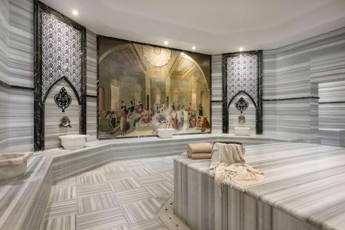 a large room with a painting on the wall at Oz Hotels Side Premium in Side