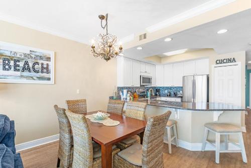 a dining room with a table and chairs at San Carlos 1503 in Gulf Shores