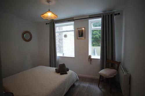 a bedroom with a bed and a window at Two Bed Flat Sea view Old town Hastings in Hastings