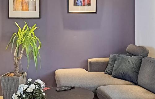 a living room with a couch and a table at Beautiful Apartment In Fredrikstad in Fredrikstad