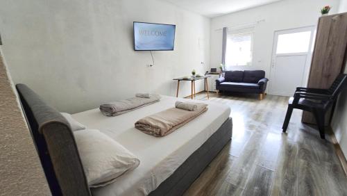 a bedroom with a large bed with pillows on it at Cozy Studio Apartment In The Black Forest in Villingen-Schwenningen