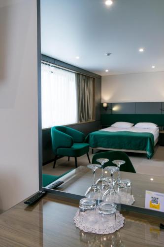 a hotel room with a bed and a mirror at Житомир by Optima in Zhytomyr