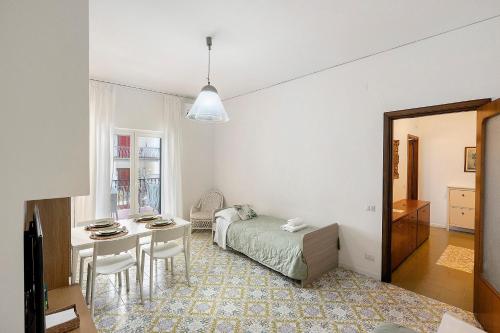 a bedroom with a bed and a table in a room at Casa Tina in Sorrento