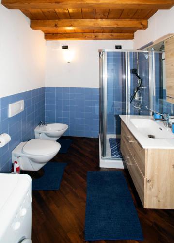 a bathroom with a toilet and a sink and a shower at Dimora RAVENNA CORTE CHARME Diaz in Ravenna