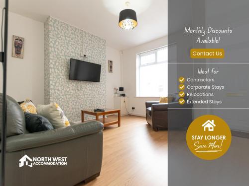 a living room with a couch and a tv at Leigh 2-Bedroom House Near Haydock & Wigan in Leigh
