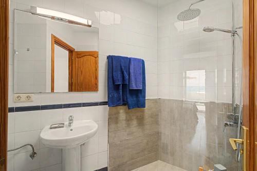 a bathroom with a sink and a shower at Callao Beach 8 in Arrieta