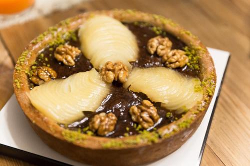 a bowl of food with nuts on top of it at Il Duomo Luxury Suite in Pietrasanta