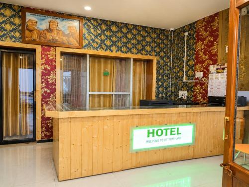 a hotel lobby with a reception desk in a building at Hotel Hill Top Palace in Lansdowne