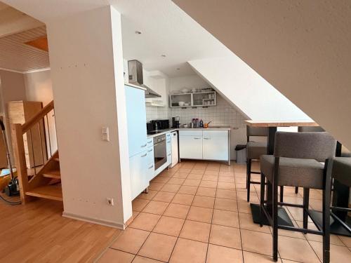 a kitchen and dining room with an attic at Generations Holiday City Lofts am Neumarkt Kölner Straße 23a in Attendorn