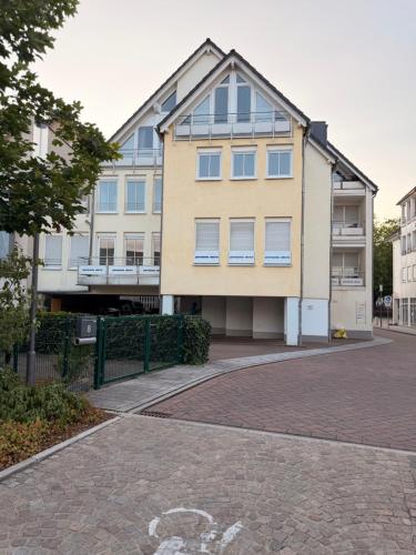 an apartment building on a brick road at Generations Holiday City Lofts am Neumarkt Kölner Straße 23a in Attendorn