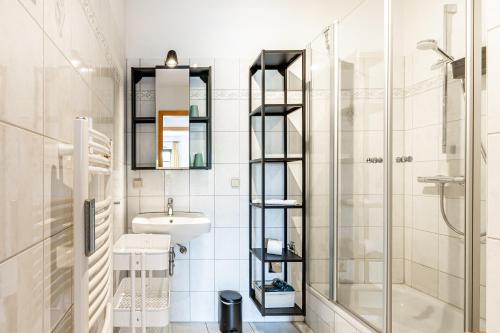 a bathroom with a shower and a sink and a toilet at Henriette in Ahrenshoop
