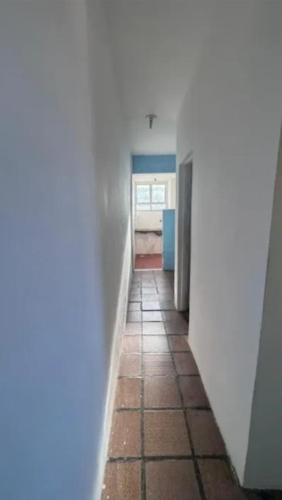 a hallway with a tile floor in a room at AbaHome Paiva in Cabo de Santo Agostinho