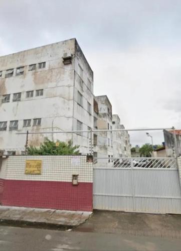 an old building with a fence in front of it at AbaHome Paiva in Cabo de Santo Agostinho