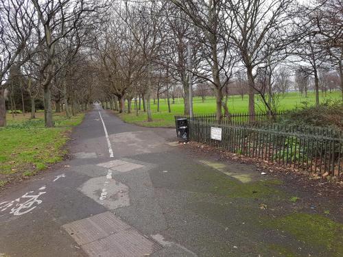 a bike path in a park next to a fence at Pia House in Dublin
