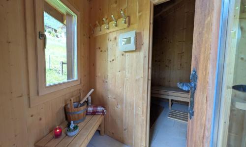 a tiny house with a bench in the corner at Chalet Veronique Private Sauna & FREE SaastalCard in Saas-Fee