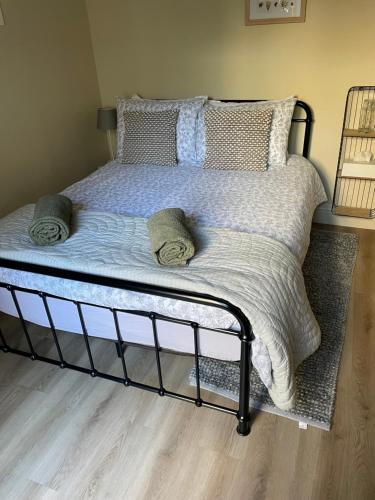 a bed with pillows and a blanket on it at Apartment in Constantine in Constantine